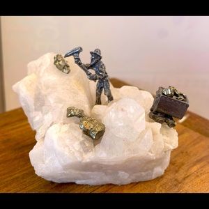 Mini mining scene on quartz